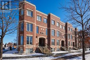 Ottawa townhouse for rent - A red brick building with a clear blue sky in the background.