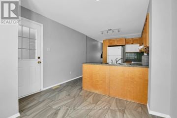 Ottawa townhouse for rent - A kitchen with a wooden counter and a sink.