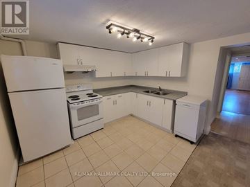 Toronto (Birchcliffe-Cliffside) apartment for rent - A kitchen with white appliances and cabinets.