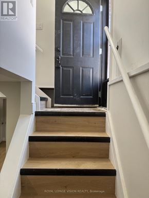 Niagara Falls (Church's Lane) apartment for rent - A set of stairs leading to a black door.