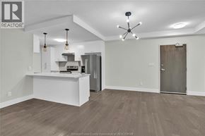 Lasalle condo for rent - A spacious kitchen area with a white counter and a ceiling fan.