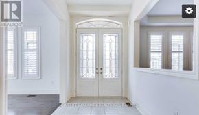 Oakville (Jm Joshua Meadows) apartment for rent - A white door with a glass window is in the middle of a room.