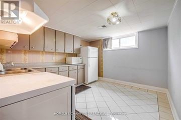 Toronto (Downsview-Roding-Cfb) apartment for rent - A kitchen with white cabinets and a white refrigerator.