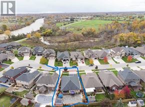 Welland (Coyle Creek) apartment for rent - A bird's eye view of a residential area with a river flowing through it.