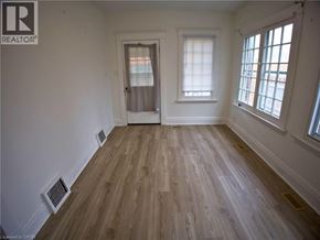 Woodstock apartment for rent - A room with wooden flooring and white walls.