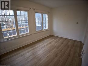 Woodstock apartment for rent - A room with wooden flooring and two windows.