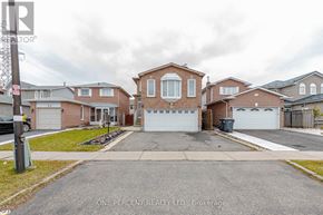 Brampton (Fletcher's Creek South) apartment for rent - A white washing machine in a small laundry room.