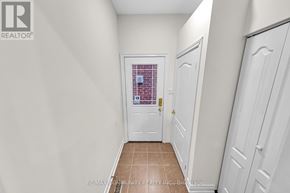 Markham (Legacy) apartment for rent - A hallway with white doors and a tiled floor.