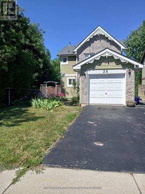 Brampton (Heart Lake West) apartment for rent - A house with the number 24 on it has a white garage door.
