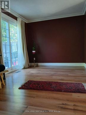 Brampton (Heart Lake West) apartment for rent - A room with a red rug on the floor.
