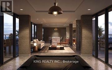 Toronto (Birchcliffe-Cliffside) condo for rent - A modern living room with a large sofa and a coffee table.