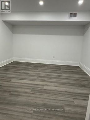 Aurora (Aurora Highlands) apartment for rent - A room with wooden flooring and a white wall.