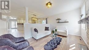 Barrie (East Bayfield) apartment for rent - A living room with a white couch and a coffee table.