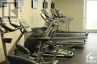 Ottawa condo for rent - A row of treadmills are lined up in a gym.