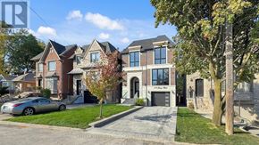 Toronto (Bedford Park-Nortown) apartment for rent - A row of houses with a car parked in front of the first one.