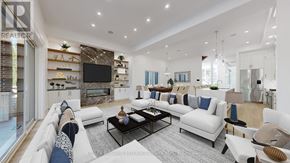 Toronto (Bedford Park-Nortown) apartment for rent - A modern living room with a white sofa set and a black coffee table.