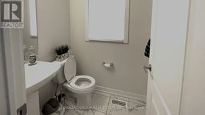 Haldimand apartment for rent - A small bathroom with a toilet and a sink.