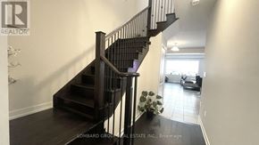 Haldimand apartment for rent - A staircase with a metal railing and wooden steps.