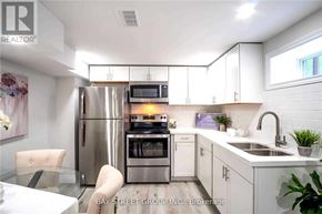 Hamilton (Burkholme) apartment for rent - A modern kitchen with white cabinets and stainless steel appliances.