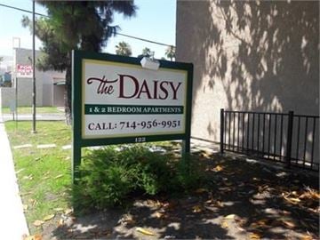 Anaheim apartment for rent - A sign for The Daisy 1 and 2 bedroom apartments.