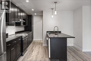 Windsor apartment for rent - A modern kitchen with dark wood cabinets and a center island.