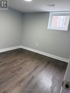 Hamilton (Crown Point) duplex for rent - A room with a window and wooden flooring.