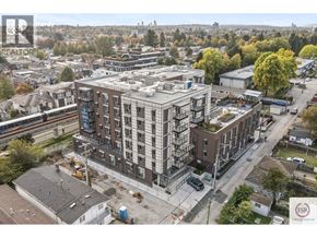 Vancouver apartment for rent - A construction site with a building under construction in the foreground and a residential area in the background.
