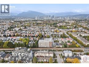Vancouver apartment for rent - A cityscape with a bridge and buildings in the foreground.