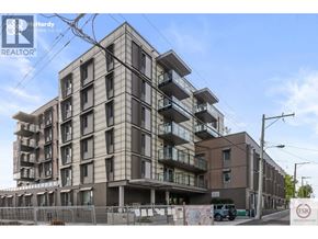 Vancouver apartment for rent - A multi-story residential building under construction with a clear sky in the background.