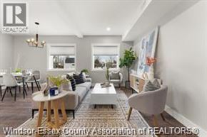 Essex apartment for rent - A well-lit living room with a couch, chairs, and a coffee table.