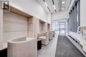 Toronto (Mount Pleasant West) condo for rent - A modern waiting area with white walls and grey carpet.