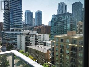 Toronto (Mount Pleasant West) condo for rent - A cityscape with buildings of various heights and a cloudy sky.