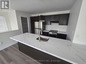 Markham (Cornell) apartment for rent - A kitchen with a marble countertop and a refrigerator.