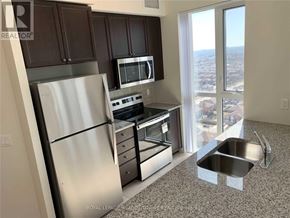 Mississauga (Creditview) condo for rent - A kitchen with a stainless steel refrigerator, microwave, oven, and sink.