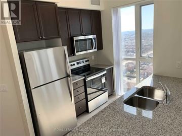 Mississauga (Creditview) condo for rent - A kitchen with a stainless steel refrigerator, microwave, oven, and sink.