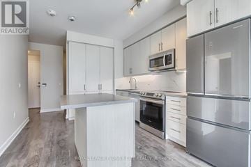 Richmond Hill (Langstaff) condo for rent - A kitchen with white cabinets and stainless steel appliances.