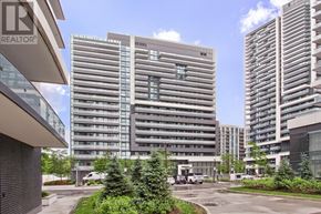 Richmond Hill (Langstaff) condo for rent - A modern building with a glass facade stands tall among other buildings.