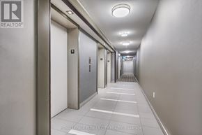 Richmond Hill (Langstaff) condo for rent - A long hallway with doors on both sides and a light on the ceiling.
