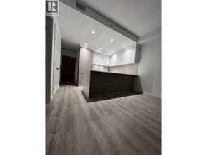 New Westminster apartment for rent - A room with a wooden floor and a white ceiling with a light on it.