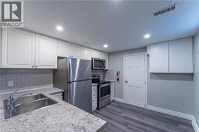 Hamilton apartment for rent - A kitchen with a sink, stove, and refrigerator.