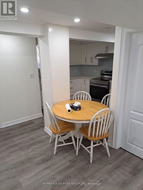 Toronto (Kennedy Park) apartment for rent - A dining room with a round table and chairs.