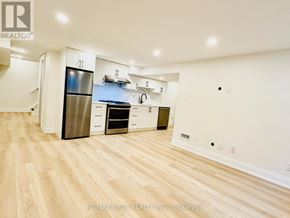 Toronto (Centennial Scarborough) apartment for rent - A kitchen with a refrigerator, oven, and sink.