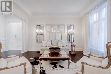 Vaughan (Kleinburg) apartment for rent - A living room with a white couch and a coffee table.