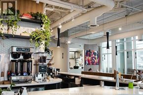 Ottawa apartment for rent - A modern cafe with a counter and a coffee machine.