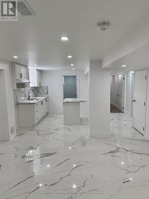 Whitby (Williamsburg) apartment for rent - A white marble floor in a spacious room.