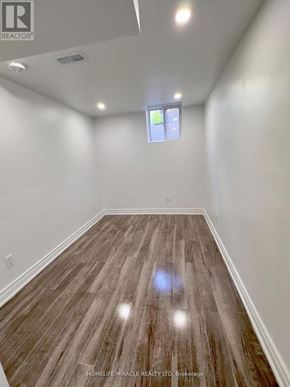 Whitby (Williamsburg) apartment for rent - A room with wooden flooring and a window.