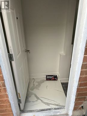 Whitby (Williamsburg) apartment for rent - A white door with a key in the lock.