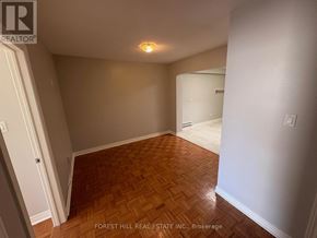 Oakville (Oo Old Oakville) apartment for rent - A room with wooden flooring and white walls.