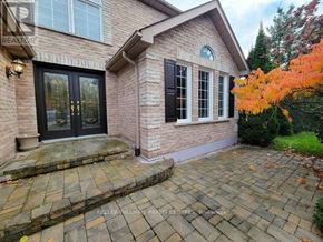 Barrie (Northwest) apartment for rent - A house with a brick facade and a black door.