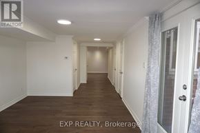 Newmarket (Glenway Estates) apartment for rent - A long hallway with white walls and wood floors.